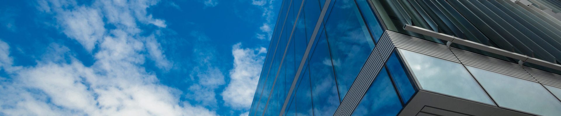 Low angle view of office building on a sunny day